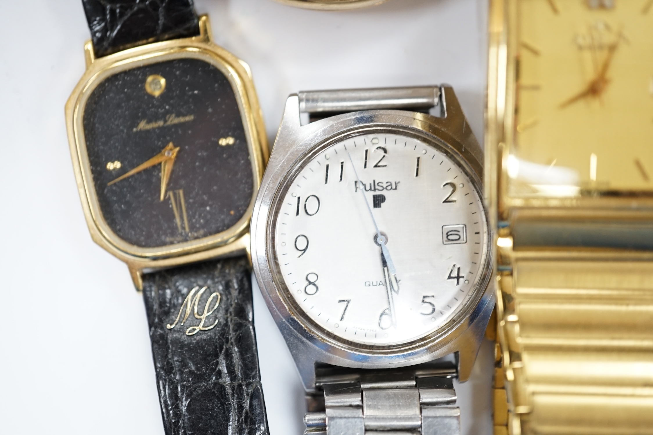 A small group of assorted wrist and pocket watches including a gold plated hunter and a Roamer Searock.